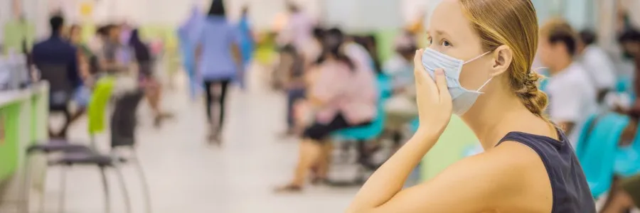 A woman in a waiting room in a hospital